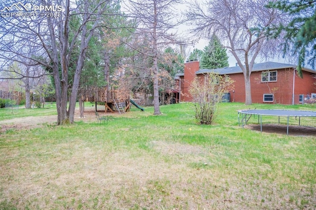 view of yard with a trampoline
