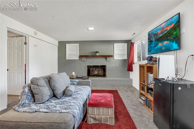 4230 Hollow Rd, Colorado Springs, CO 80917 - living area featuring a brick fireplace, carpet flooring, and a textured ceiling
