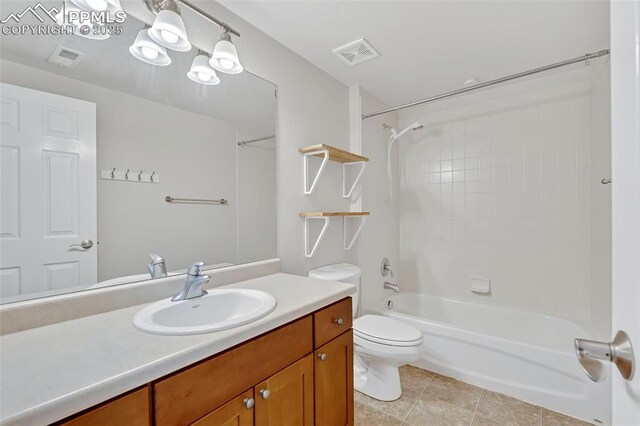 16850 Buffalo Valley Path, Monument, CO 81032 - full bath with vanity, tile patterned floors, toilet, visible vents, and tub / shower combination