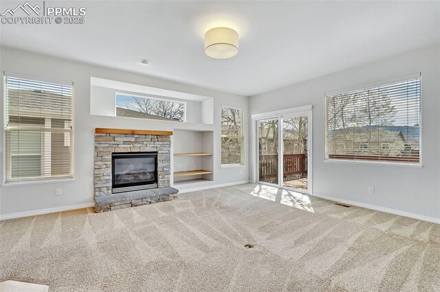 16850 Buffalo Valley Path, Monument, CO 81032 - unfurnished living room with baseboards, visible vents, and carpet