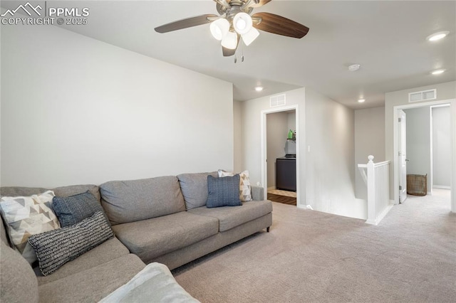 carpeted living room with baseboards, visible vents, recessed lighting, and ceiling fan
