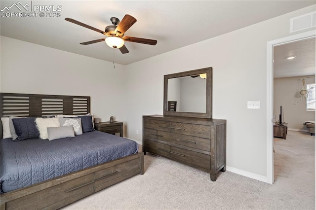 carpeted bedroom with visible vents, a ceiling fan, and baseboards