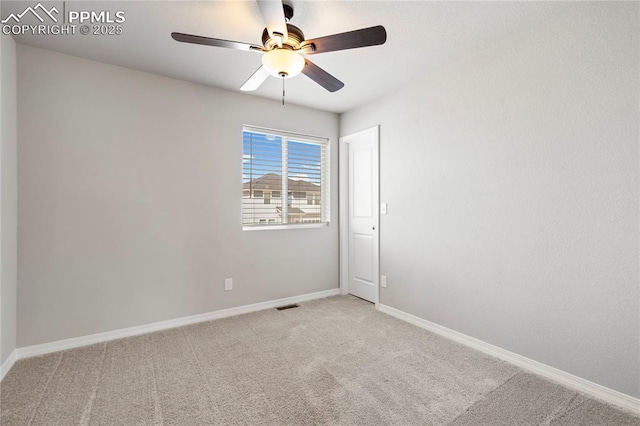 unfurnished room with ceiling fan, baseboards, carpet flooring, and visible vents