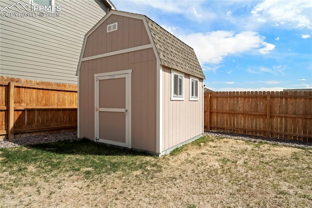 view of shed with a fenced backyard