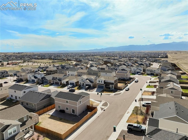 drone / aerial view with a mountain view and a residential view