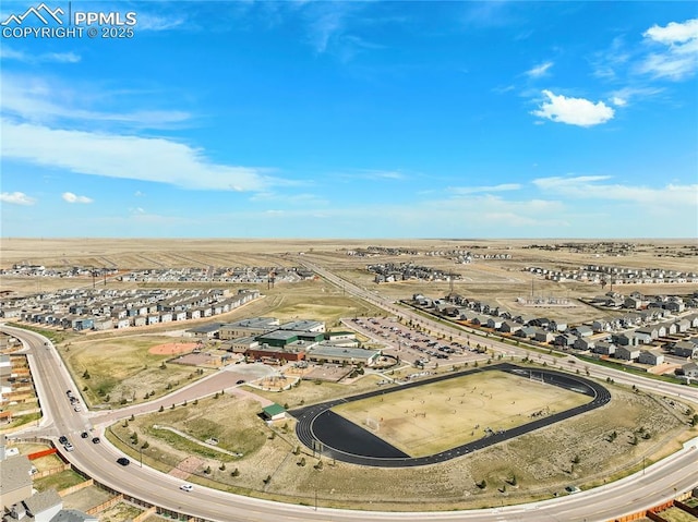 birds eye view of property with a residential view