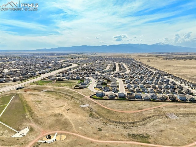 drone / aerial view with a residential view and a mountain view
