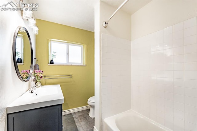 413 E Fontanero St, Colorado Springs, CO 80907 - bathroom with shower / bathtub combination, baseboards, vanity, and toilet
