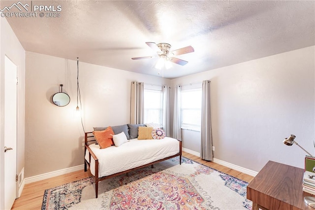 413 E Fontanero St, Colorado Springs, CO 80907 - bedroom with baseboards, ceiling fan, and light wood-style flooring