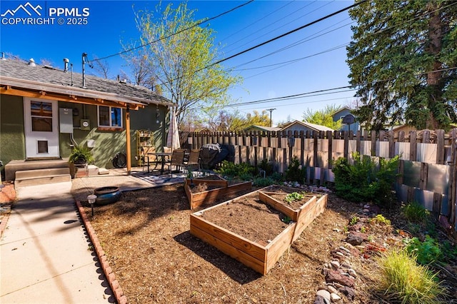 413 E Fontanero St, Colorado Springs, CO 80907 - view of yard with a patio, a garden, and fence