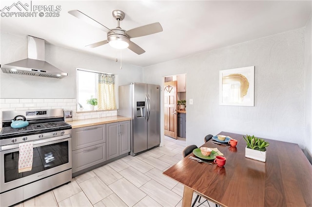 413 E Fontanero St, Colorado Springs, CO 80907 - kitchen featuring wall chimney range hood, a ceiling fan, light countertops, gray cabinetry, and stainless steel appliances