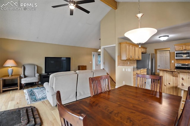 555 Elfin Glen Dr, Divide, CO 80814 - dining area with a ceiling fan, beam ceiling, light wood-style floors, and high vaulted ceiling