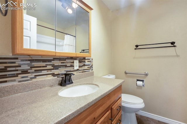 555 Elfin Glen Dr, Divide, CO 80814 - bathroom with decorative backsplash, toilet, vanity, a shower with shower curtain, and baseboards