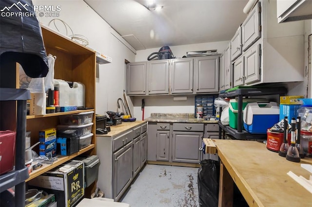 555 Elfin Glen Dr, Divide, CO 80814 - kitchen featuring gray cabinetry and concrete flooring