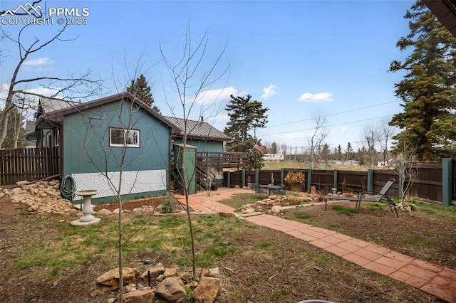 555 Elfin Glen Dr, Divide, CO 80814 - rear view of house with fence