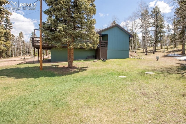 555 Elfin Glen Dr, Divide, CO 80814 - view of grassy yard featuring a wooden deck