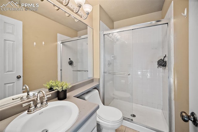8545 Salsifa Ter, Colorado Springs, CO 80920 - bathroom with a stall shower, toilet, and vanity