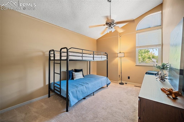8545 Salsifa Ter, Colorado Springs, CO 80920 - carpeted bedroom featuring a textured ceiling, lofted ceiling, baseboards, and ceiling fan