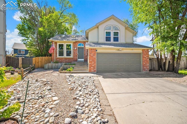 8545 Salsifa Ter, Colorado Springs, CO 80920 - view of front facade featuring brick siding, an attached garage, and concrete driveway