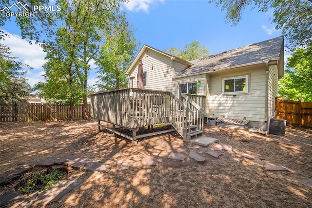 8545 Salsifa Ter, Colorado Springs, CO 80920 - rear view of property featuring a deck, a fenced backyard, and a shingled roof