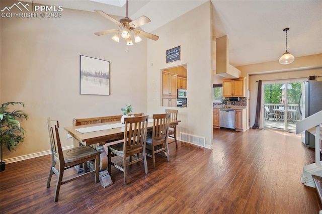 8545 Salsifa Ter, Colorado Springs, CO 80920 - dining area with a ceiling fan, dark wood finished floors, baseboards, and a towering ceiling