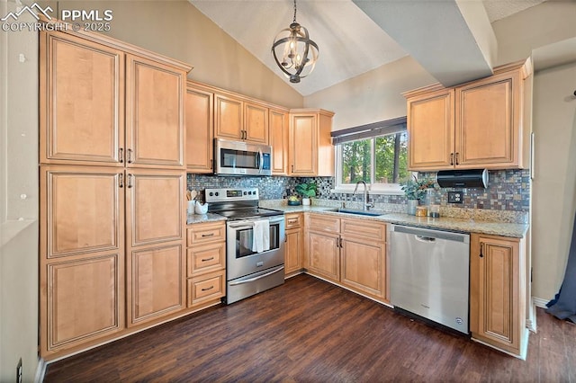 8545 Salsifa Ter, Colorado Springs, CO 80920 - kitchen featuring stainless steel appliances, a sink, dark wood-style flooring, vaulted ceiling, and decorative backsplash