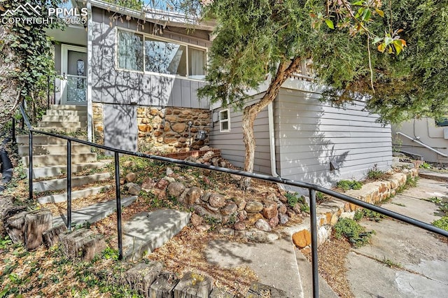 1624 Cheyenne Blvd, Colorado Springs, CO 80906 - view of side of property with stairs and stone siding