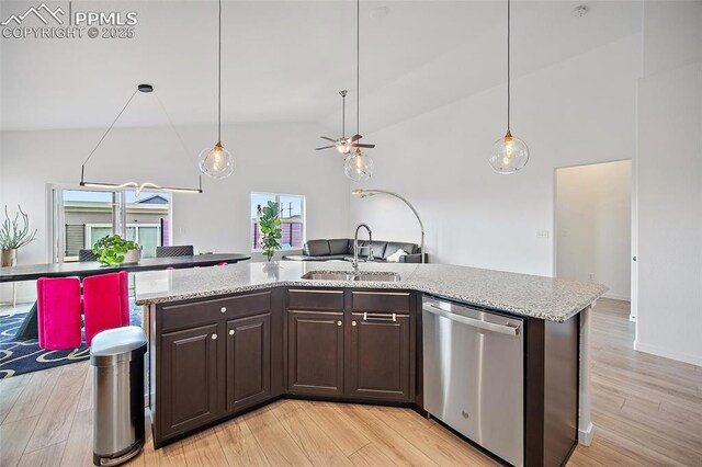 kitchen with light wood-style floors, dark brown cabinets, ceiling fan, dishwasher, and a sink