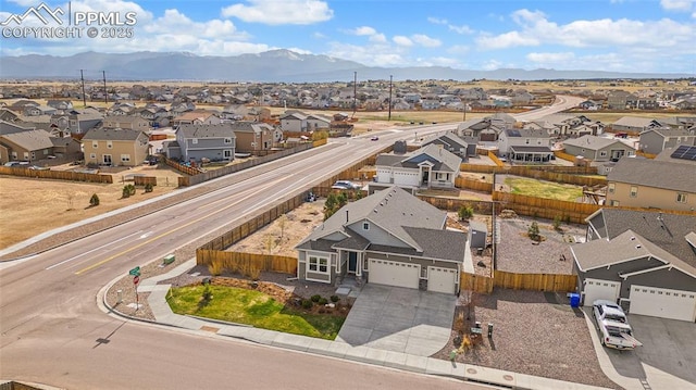aerial view featuring a mountain view and a residential view