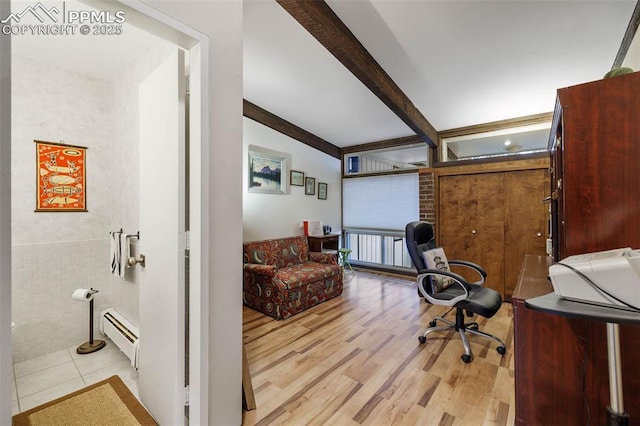 office area featuring baseboard heating, light wood-style flooring, and beam ceiling