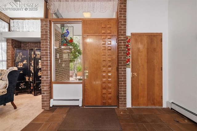 foyer entrance with a baseboard radiator
