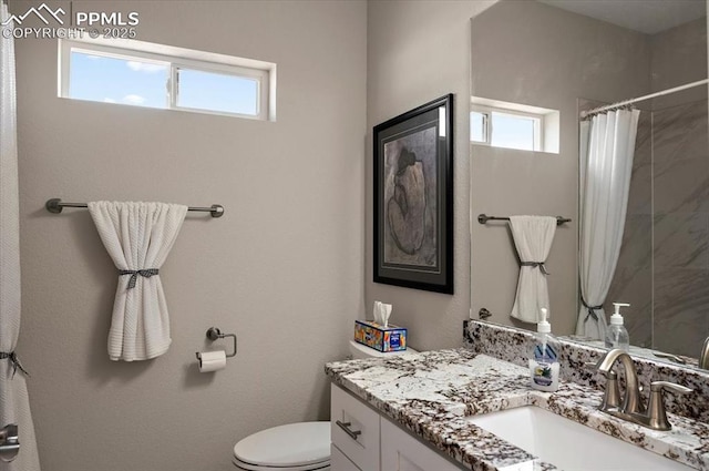 full bathroom with toilet, curtained shower, vanity, and plenty of natural light