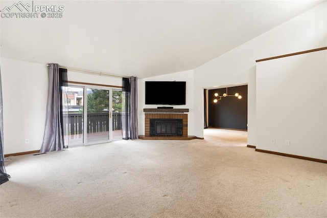 unfurnished living room featuring baseboards, carpet, lofted ceiling, and a fireplace