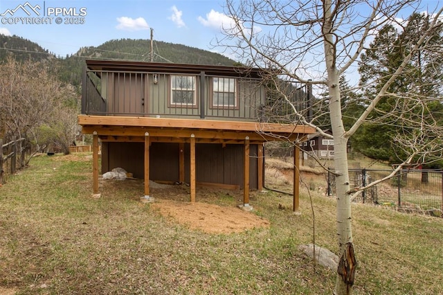 view of outdoor structure featuring fence