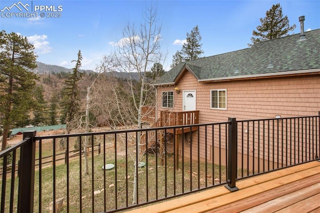 wooden deck with a mountain view