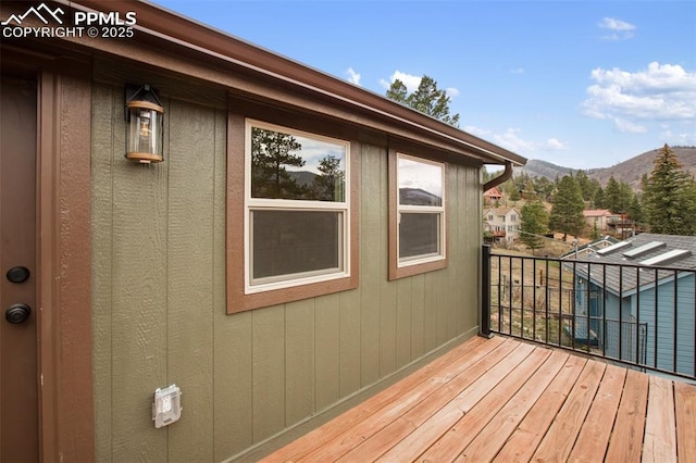 wooden terrace featuring a mountain view