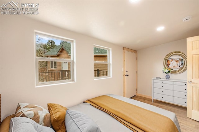 bedroom featuring light wood-style floors and recessed lighting