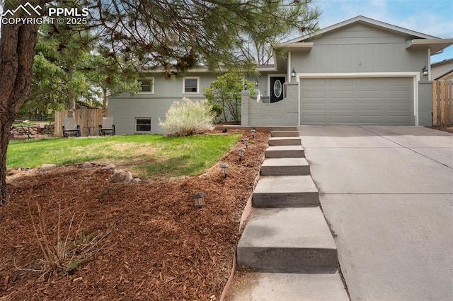 ranch-style home with driveway, a front yard, an attached garage, fence, and brick siding