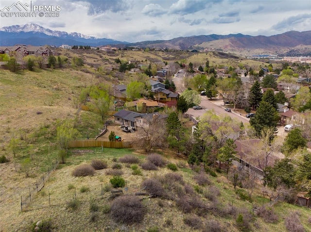 birds eye view of property featuring a mountain view and a residential view