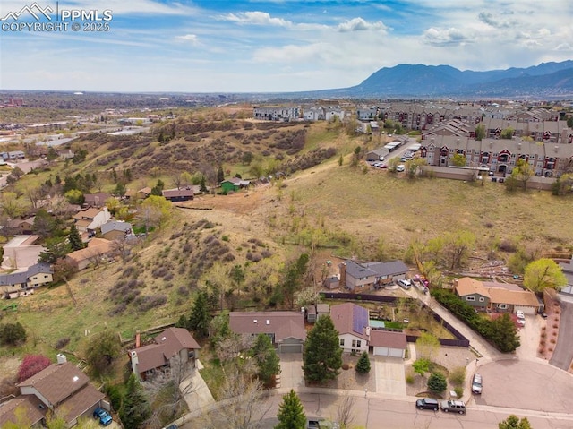 drone / aerial view with a mountain view and a residential view