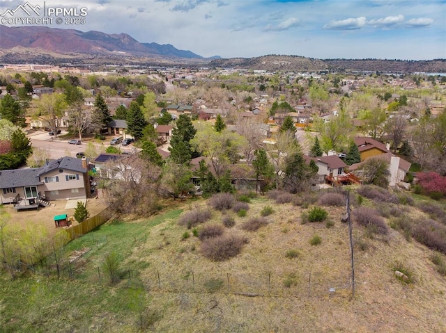 birds eye view of property featuring a mountain view and a residential view