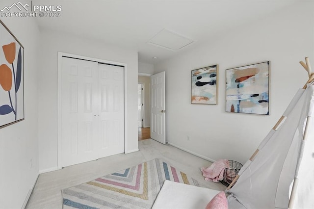 5012 Chaise Dr, Colorado Springs, CO 80923 - carpeted bedroom featuring attic access, a closet, and baseboards