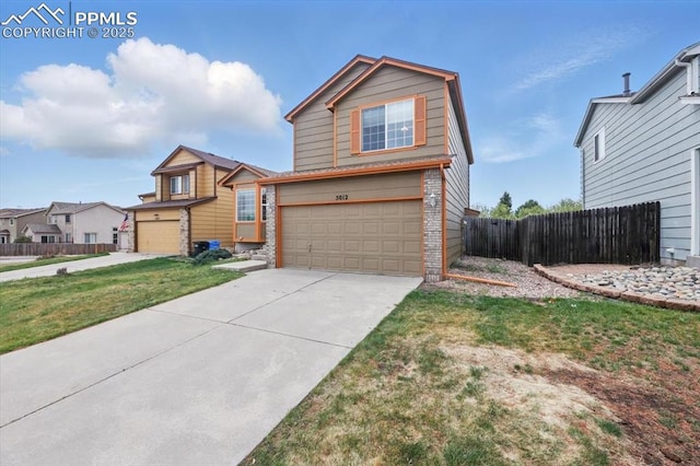 5012 Chaise Dr, Colorado Springs, CO 80923 - traditional-style house with an attached garage, brick siding, and driveway