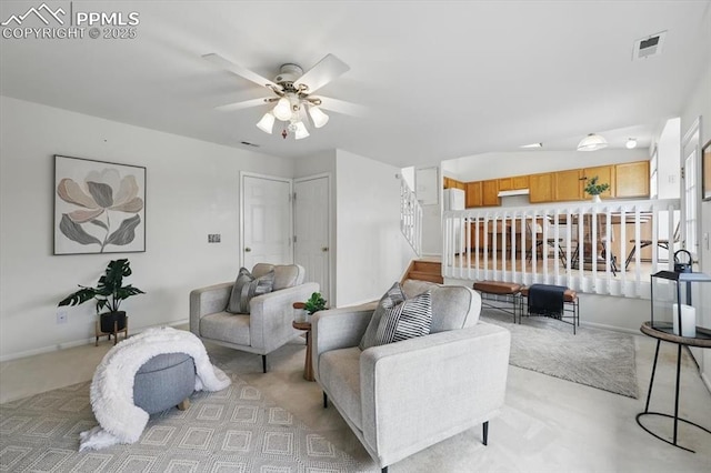 5012 Chaise Dr, Colorado Springs, CO 80923 - living area featuring a ceiling fan, light carpet, stairway, and baseboards