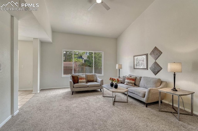 living area featuring ceiling fan, carpet floors, and baseboards