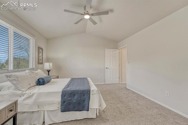 carpeted bedroom with baseboards, ceiling fan, and vaulted ceiling