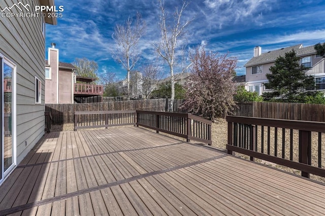 deck with a fenced backyard