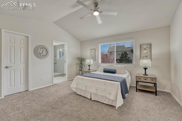 bedroom with baseboards, ensuite bathroom, lofted ceiling, and carpet flooring