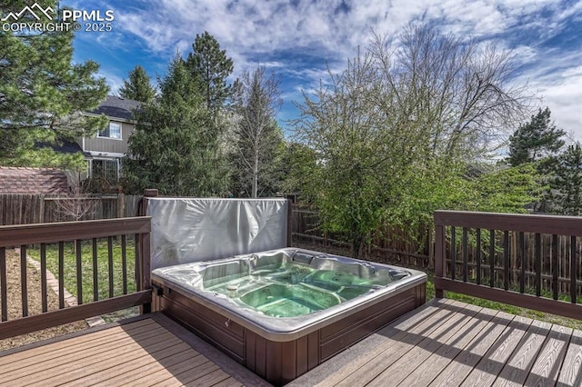 deck with fence and hot tub deck surround