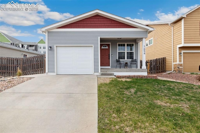 single story home with covered porch, driveway, a garage, fence, and a front lawn